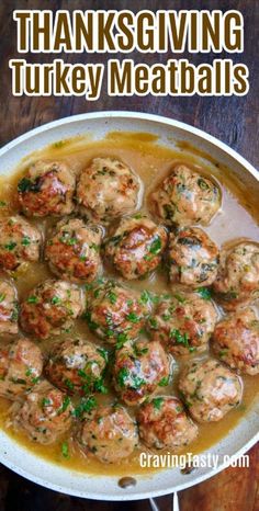 turkey meatballs with gravy in a white bowl on a wooden table and the words thanksgiving turkey meatballs