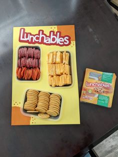 lunchables are displayed on a table with crackers and snacks in trays