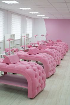 a room filled with lots of pink couches