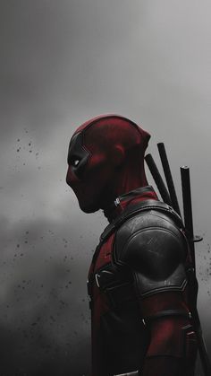 deadpool standing in the rain with his back to the camera, looking at something