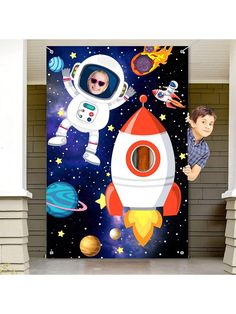 a door with an image of two children on the outer planets and a rocket ship