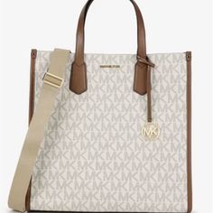 Michael Kors Maple Large Ns Logo Tote Vanilla/Cream/Tan Beautiful Tote Bag Xterior Color: Cream/White Bag Width: 14.25" Size: Large Pattern: Logo Closure: Snap Bag Height: 14.25" Bag Depth: 5" White Bags With Leather Trim For Shopping, White Shoulder Bag With Leather Trim For Shopping, White Leather Trim Shoulder Bag For Shopping, Casual White Bags With Leather Trim, Ns Logo, Snap Bag, Vanilla Cream, Garment Bags, Walker Boots