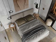 an aerial view of a bedroom with a bed, nightstands and lamps on the wall