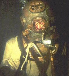 a man wearing a diving suit and mask