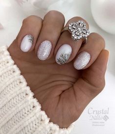 Experience the blend of winter's soft snow and the promise of spring's bloom with this nail design, featuring white and silver glitter nails adorned with delicate black botanical art. Perfectly representing February's transition, it offers a hint of sparkle amidst the wintry tones. Click to see more and get inspired!via@nailcocktail Nails For Nyc, White Xmas Nails, February Nail Colors, Nail Noel, Snow Nails, Nail Color Trends, February Nails