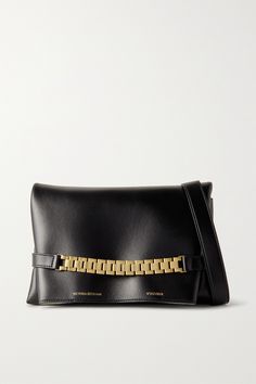 You'll find so many ways to style Victoria Beckham's classic clutch. Made in Italy from the softest leather, it has a neat rectangular profile and comes with a detachable strap, so you can wear it as a shoulder bag. The gold-tone chain draws inspiration from a much-loved vintage watch strap, sourced from the designer's own collection. Timeless Leather Clutch For Everyday Luxury, Victoria Beckham Bags, The Row Bag, Shoe Boot Sandals, Leather Clutch Bags, Fine Jewelry Designers, Leather Pouch, Leather Chain, Blue Bags