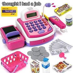 a pink toy cash register with money and other items surrounding it on a white background