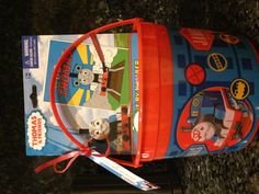 a thomas the train toy in a plastic pail