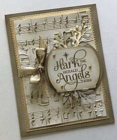 a handmade card with music notes and a bow on the front that says, hair is herald angels sing