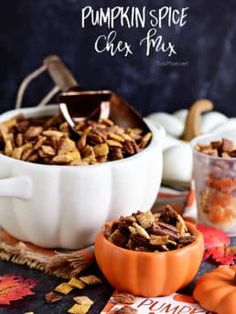 pumpkin spice chex mix in a white bowl on top of a table with candy