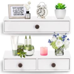 a white dresser with flowers, candles and other personal care items sitting on top of it