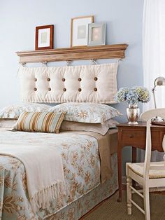 a bedroom with blue walls and white furniture