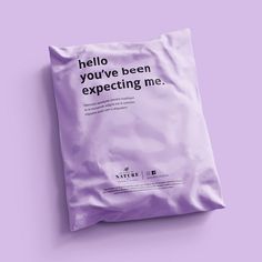 a purple bag with the words hello you've been expecting me on it, against a lila background