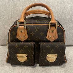 Authentic Louis Vuitton Monogram Manhattan Pm. Preowned. From 2005. Size: 11.5x8x5.75 Inches. Made In France. Code: Th0025. Comes With Tag And Dustbag. Handbag Is Used, Zipper Works But Seems A Bit Dry. Please Reference Photos. All Items From My Personal Collection. From A Smoke Free Pet Free Home. Same Day/Next Day Shipping. No Trades. Thanks For Looking. Tags:Preowned Lv, Preowned Vuitton, Preowned Louis Vuitton, Preowned Manhattan Pm, Preowned Manhattan, Lv Sale, Vuitton Sale, Preowned Monogram, Lv, Vuitton Bags Louis Vuitton, Reference Photos, Authentic Louis Vuitton, Womens Tote Bags, Made In France, Louis Vuitton Bag, Louis Vuitton Monogram, Manhattan, Dust Bag