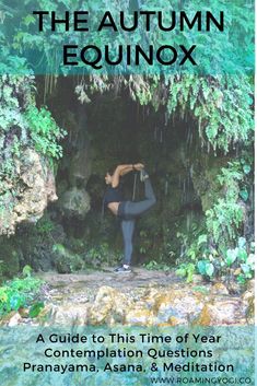 a woman in black yoga outfit standing in front of a cave with trees and moss