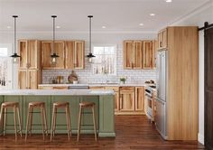 a large kitchen with wooden cabinets and stools