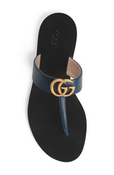 Antiqued double-G hardware-which is based on a '70s archival design-boldly brands the wide instep strap of this leather thong sandal. For a bit more traction and signature charm, a rubberized sole pad is embossed with a bee representing wisdom and love. Style Name:Gucci Gg T-Strap Sandal (Women). Style Number: 5485067. Leather Thong Sandals, Strap Sandals Women, T Strap Sandals, Sandal Women, Thong Sandals, T Strap, Strap Sandals, Flip Flops, Womens Sandals