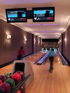 a bowling alley with lanes full of bowling balls