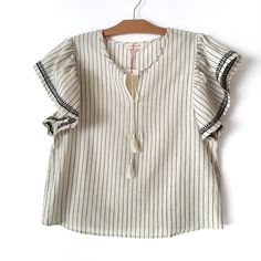 Solitaire Oatmeal Striped Ruffle Sleeve Blouse Top. Short Sleeve With Embroidered Trim. Tassel Tie. 100% Cotton. Brand New With Tag. Please See Details On The Pictures And Feel Free To Ask Any Questions. Beige Ruffles Blouse For Brunch, Beige Ruffle Blouse For Brunch, Beige Ruffle Sleeve Tops For Brunch, Beige Ruffled Blouse For Brunch, Beige Ruffled Top With Flutter Sleeves, Beige Ruffled Flutter Sleeve Top, Beige Flutter Sleeve Blouse For Spring, Beige Short Sleeve Blouse For Brunch, Chic Beige Tops With Flutter Sleeves