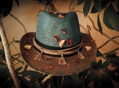 **FREE SHIPPING** One-Off, Custom/ Handpainted Fedora Hat. handpainted & decorated in a boho style. There is  a brown cord with tussels & dried leaves decorating the hat. 100% Paper Straw SIZE: 58-59cm *The number is the perimeter of the head expressed in centimeters (cm). To find your number (size), take a measuring tape and measure the perimeter of the head. The tape measure should be placed in the middle of the forehead and just above the ears (about 0.5 cm, above the ears). Hold the tape measure firmly, but not too tightly (Hats are not supposed to be very tight). The centimeters that you will see in the measuring tape, is also the number of the hat. (There is an example of how to measure your head in the photos). *Ready to ship Please, feel free to message me any questions you may hav Bohemian Hand Painted Hats With Short Brim, Bohemian Hand Painted Short Brim Hat, Bohemian Wide Brim Hand Painted Hat, Bohemian Hand Painted Sun Hat For The Beach, Bohemian Hand Painted Sun Hat For Vacation, Bohemian Hand Painted Sun Hat For Beach, Bohemian Hand Painted Hats For Vacation, Bohemian Hand Painted Straw Hat For Vacation, Bohemian Sun Hat With Hand Painted Short Brim