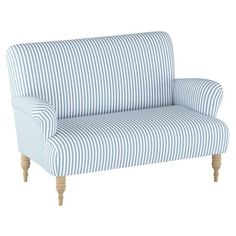 a blue and white striped couch with wooden legs