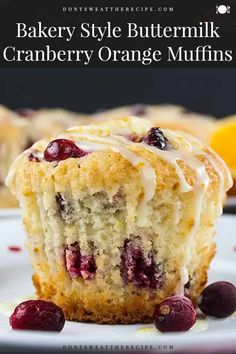 a close up of a muffin on a plate with cranberry orange muffins