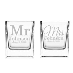 two personalized shot glasses sitting side by side