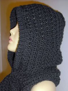 a mannequin wearing a black knitted hooded scarf