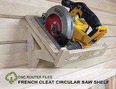 a circular saw shelf mounted on the side of a wall