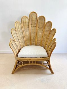 a chair made out of wicker with a cushion