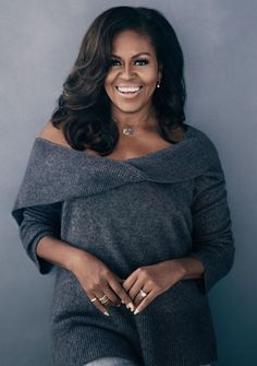 the first lady is smiling and posing for a photo with her hands on her hips