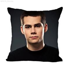 a man's face is shown on a black pillow cover with the image of him