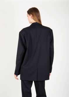 Product Description: Elevated take on a workwear staple with this oversized blazer. The design has an elongated single-breasted silhouette and two flap pockets in the front. It has drop shoulder and oversized fit that borrows from masculine styles. Wear yours with everything from denim to midi dresses. Fabric: 97% Wool ; 3% Spandex Color: Black Size and Fit: Our model is 5'10" and is wearing a size XS. Oversized Fit Care Instructions: Dry clean Only Modern Business Blazer With Concealed Front Fastening, Oversized Blazer With Pockets, Oversized Outerwear With Patch Pockets For Work, Oversized Blazer With Double Button And Notch Lapel, Oversized Office Blazer With Pockets, Oversized Single Breasted Outerwear For Work, Single Breasted Oversized Outerwear For Work, Oversized Notch Lapel Blazer With Double Button Closure, Oversized Blazer With Patch Pockets And Long Sleeves