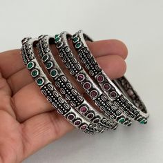 Restocked Multicolored Stones Oxidized Silver Bangles(4 Pc)/German Silver/Black Metal/Boho/Tribal/Indian Jewelry/Pakistani /Oxidized Bangles This is 100% Handmade jewelry. So Color, shades, texture displayed may slightly vary from the actual product due to digital image limitations. We request you to consider these minor variations. Please expect the possibility of some slight imperfections when buying handmade jewelry. If you have any questions, please message or email us. Arrives in a gift box. Please let me know if you have any questions. Thank you so much for visiting my shop. Bohemian Multicolor Round Bangle, Oxidized Bangles, Jewelry Pakistani, San Ramon, German Silver, Oxidized Silver, Buy Handmade, Silver Bangles, Color Shades