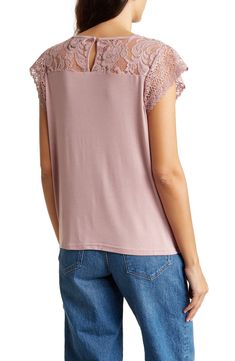 Sweeten any look with this soft knit top fashioned with lace cap sleeves and lace trim for elegant style. 24 1/2" length (size Small) Back keyhole with button-and-loop closure Crewneck Cap sleeves 95% rayon, 5% spandex Hand wash, line dry Imported Model stats: 5'10" height, 32" bust, 25" waist, 36" hip. Model is wearing size Small. Casual Stretch Top With Lace Collar, Casual Stretch Tops With Lace Collar, Feminine Top With Lace Short Sleeves, Stretch Lace Tops With Scalloped Detail, Chic Short Sleeve Scalloped Lace Top, Feminine Short Sleeve Lace Top With Scalloped Lace, Feminine Scalloped Lace Short Sleeve Top, Stretch Cotton T-shirt With Cap Sleeves, Grace And Lace