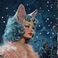 a woman with blue hair wearing a cat hat and pink fur coat in front of fireworks