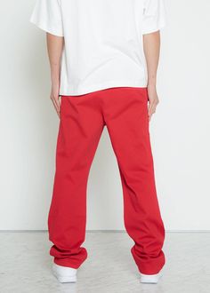 Get ready to make a statement with our Konus Men's Stretch Twill Baggy Chino Pants! Designed with a relaxed fit, these chinos offer both style and practicality. The front slash pockets provide easy access to your essentials, while the welt pockets on the back and thigh add extra storage options. You'll love the comfort and flexibility of these chinos, perfect for any occasion. Upgrade your wardrobe with our versatile and trendy chino pants. Order now and experience the ultimate combination of fa Streetwear Chinos With Pockets And Straight Hem, Streetwear Chinos With Tapered Leg, Streetwear Chinos With Hip Pockets, Tapered Leg, Straight Hem Chinos For Streetwear With Pockets, Baggy Red Cotton Sweatpants, Red Baggy Cotton Pants, Red Baggy Cotton Sweatpants, Cotton Chinos With Hip Pockets For Streetwear, Relaxed Fit Chino Cotton Twill Pants For Streetwear