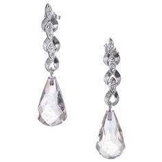 Late Art Deco light pink briolette quartz dangle earrings. Quartz bottoms with natural inclusions accented with 6 single cut diamonds in a 14k white gold settings. Circa 1940-1950. 2 briolette cut clear colorless/light pink Quartz, approx. total weight 26.00cts, SI2, 19 x 11.5mm 6 single cut diamonds H, VS, .12ct total 14k White Gold 9.8 grams Tested: 14k Top to bottom: 42.09mm or 1.65 inches Width at top: 6.48mm Luxury Briolette Diamond Earrings For Wedding, Luxury Briolette Diamond Earrings For Formal Occasions, Art Deco Light, Late Art, Accessory Jewelry, Diamond Dangle Earrings, Pink Topaz, Pink Quartz, Gold Earrings Dangle