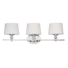 three light bathroom fixture in chrome finish with white shades on the lamps and shade shades