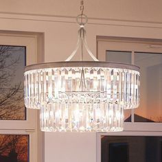 a chandelier hanging from the ceiling in a room