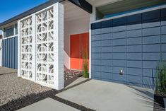 an exterior view of a home with garage doors