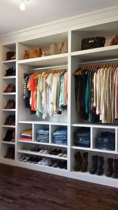 an image of a closet with clothes and shoes on the shelves in front of it