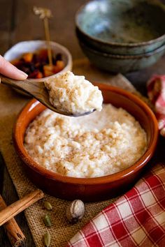 a spoon full of rice in a bowl