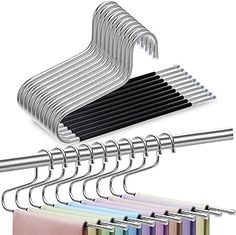 a bunch of metal clothes hangers on a white background