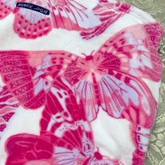 a pink and white butterfly print fabric