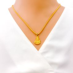 This ethereal and elegant pendant, crafted from 22k gold with a weight of 3.2 grams, features a divine depiction of Murugan Swami in a beautiful yellow gold finish. With a pendant length of 0.8 inches, it serves as a subtle yet profound symbol of youth, power, and virtue. Ideal for devotees and admirers of fine craftsmanship, this Murugan Swami pendant combines spiritual significance with timeless elegance, offering a piece of heavenly beauty and grace to any collection. PRODUCT DETAILS Gold Pur Yellow Gold Pendant Temple Necklace With Locket, Yellow Gold Temple Necklace With Pendant Locket, Yellow Gold Temple Necklace With Locket Pendant, Yellow Gold Plated Temple Necklace For Puja, Gold Plated Yellow Temple Necklace For Puja, 22k Gold Spiritual Temple Necklace, Spiritual Yellow Gold Pendant Temple Necklace, 22k Yellow Gold Spiritual Temple Necklace, Spiritual 22k Yellow Gold Temple Necklace