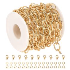 a spool of gold colored chain and hooks