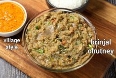 an assortment of different types of food on a cutting board with rice and sauces