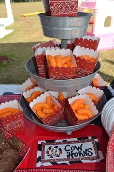 there are several trays of food on the table