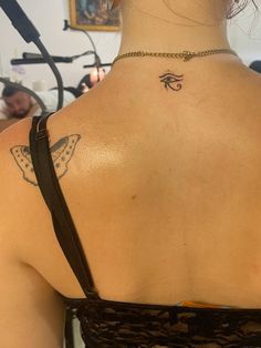 a woman with a tattoo on her back